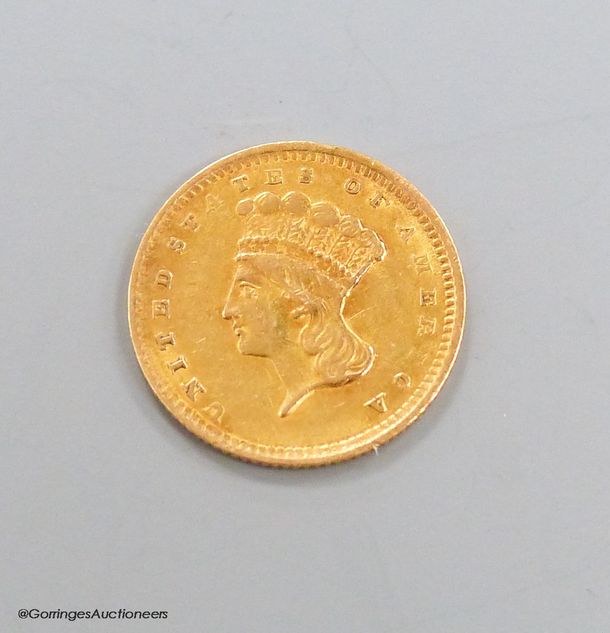 An American 1856 one dollar gold coin